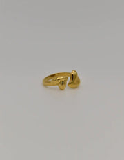 Minimalist wedding ring with open-ended heart details in gold
