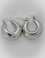 Sterling hoops styled with minimalist necklace stack
