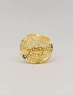 Close-up of textured wedding band ring in gold finish