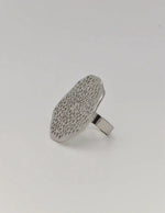 Nature-inspired silver ring on white prop display