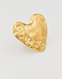 Sculpted gold heart ring on white background – hammered metal texture