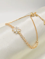adiant_blossom_happy_face_bracelet_close_up_floral_centerpiece_golden_chain