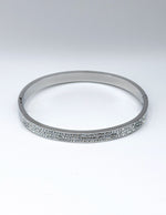 Hypoallergenic non-tarnish high polish silver rigid crystal bangle UAE.