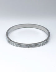 Hypoallergenic non-tarnish high polish silver rigid crystal bangle UAE.
