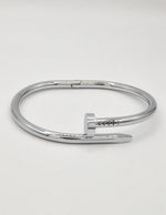 Stylish silver twist nail bracelet, minimalist Canadian streetwear jewellery.