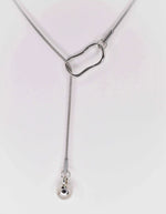 Modern silver necklace on white background, clean design